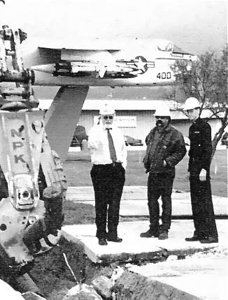 Removing jet fuel line in OU-2B cleanup area in 1999.  Jet monument is in background.