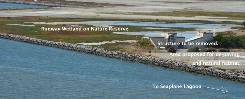 Alameda Point Channel in foreground that connects San Francisco Bay to the Seaplane Lagoon.  