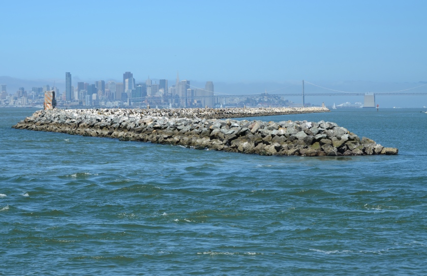 Breakwater Island.  Alameda Point is to the right.  San Francisco Bay is to the left.  San Francisco is in the background.