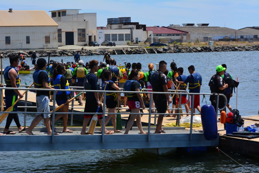 Dragon boat teams boarding their boats