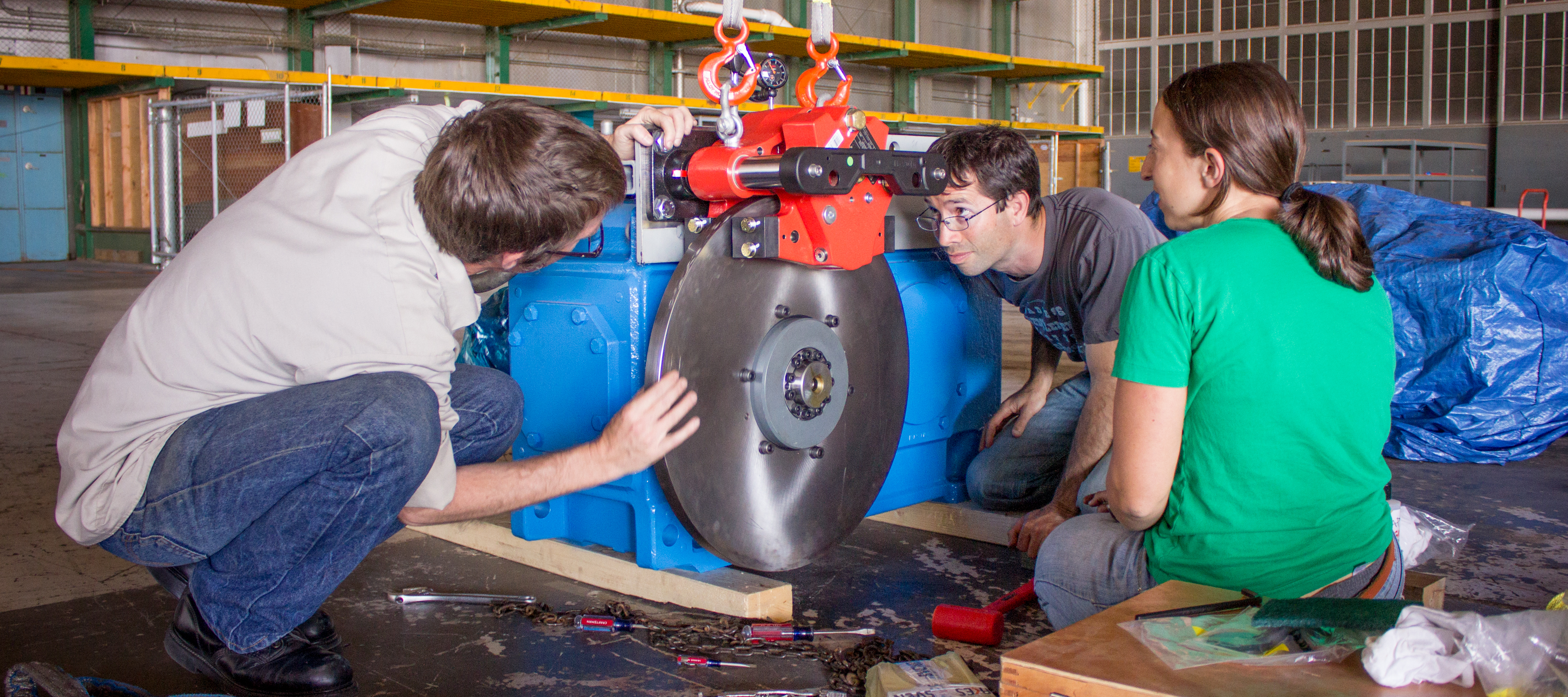 Employees assembling gearbox at Alameda Point hangar. Natel Energy photo. Used by permission.