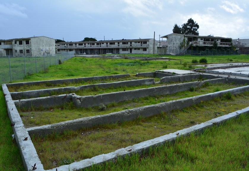 View from Orion Street looking east at abandoned Navy housing in the Main Street Neighborhood sub-district.  Eight buildings were demolished on both sides of Orion Street by the city in 2011 to reduce the attractive nuisance level of the area.  
