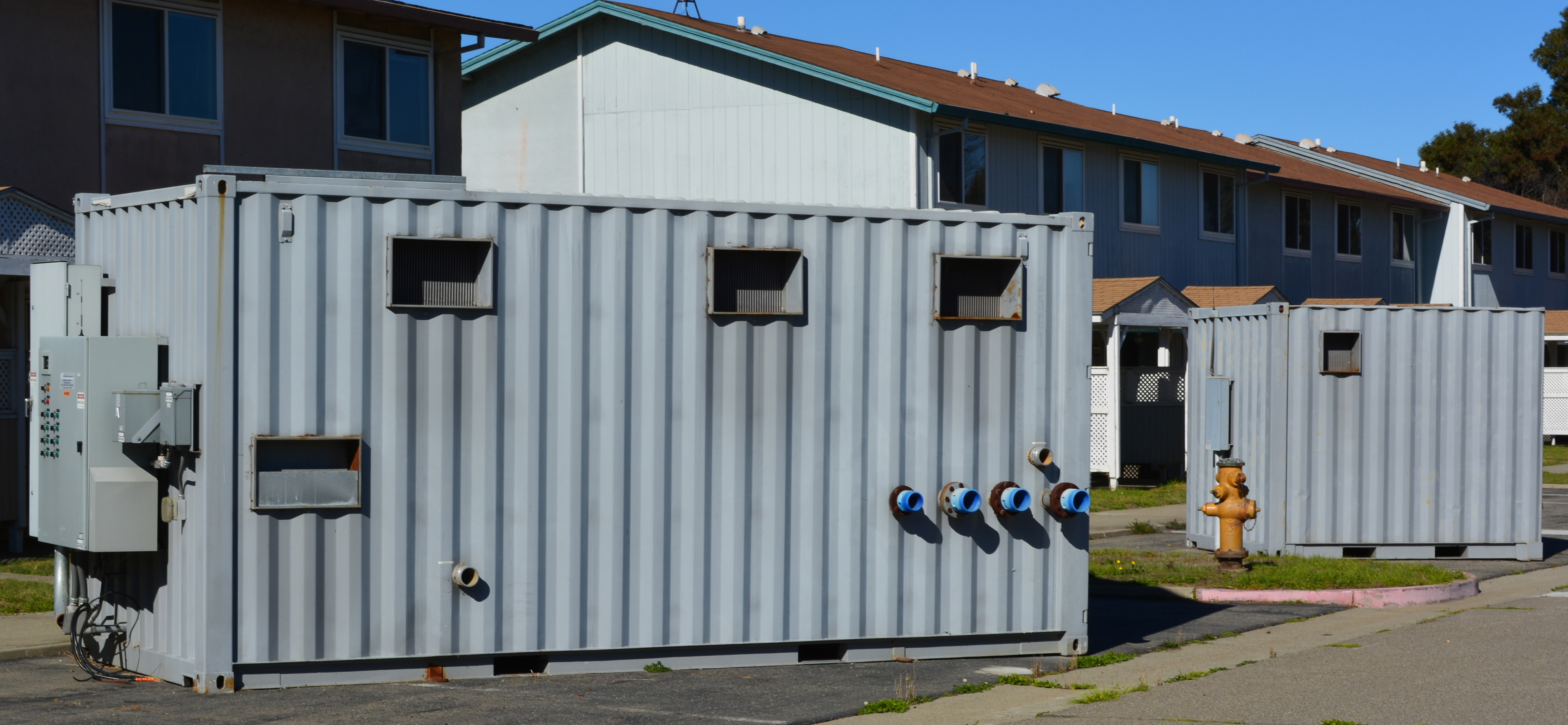Control module with pumps for groundwater cleanup system waiting to be hauled away from North Housing.