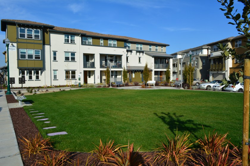 Generous landscaping complements the loft-style condominiums at Alameda Landing near Target.