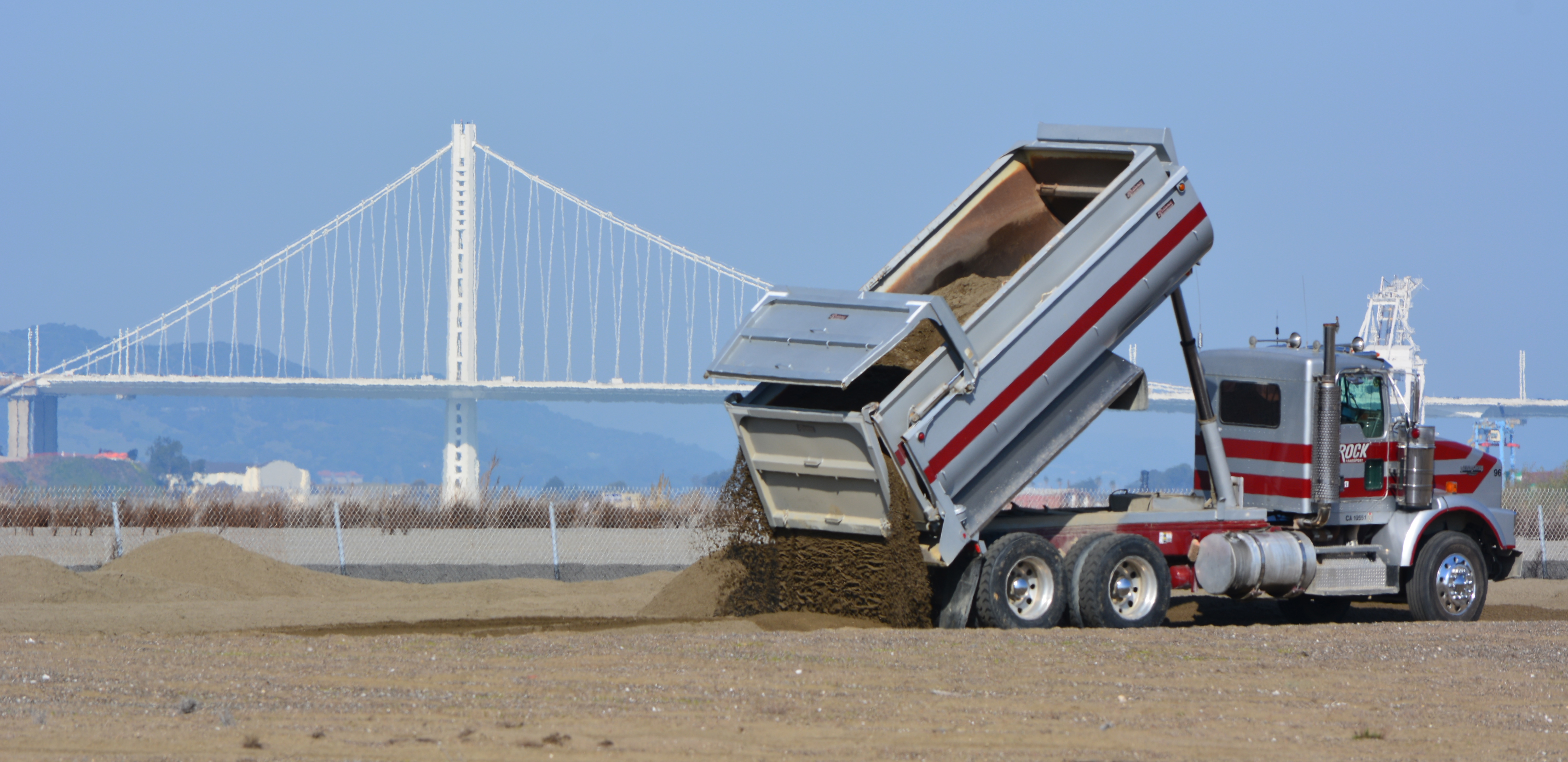 Sand being delivered to the least tern nesting grounds at Alameda Point on February 25, 2016. Bay Bridge in the background.