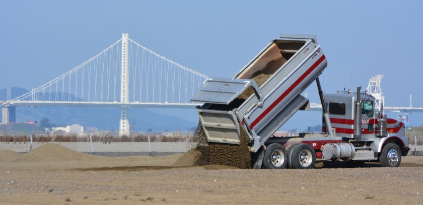 Sand being delivered to the least tern nesting grounds at Alameda Point on February 25, 2016. Bay Bridge in the background.
